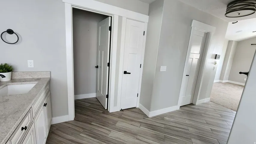 Bathroom with vanity and light wood-style flooring