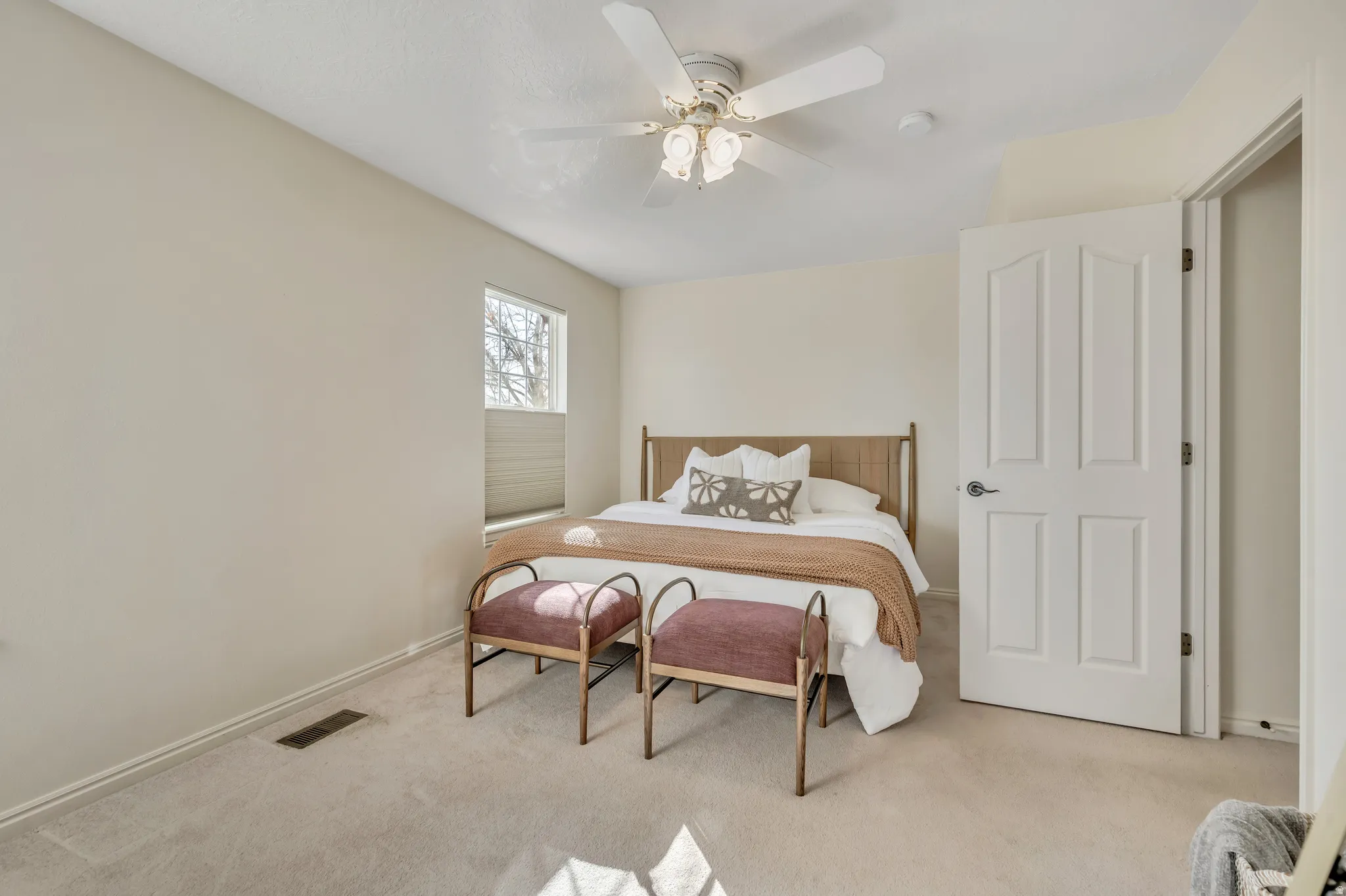 Bedroom with carpet flooring and ceiling fan