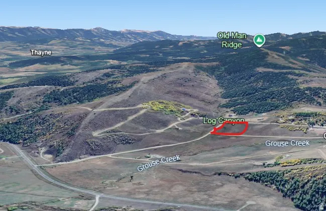 Aerial overview of property's location featuring property parcel outlined