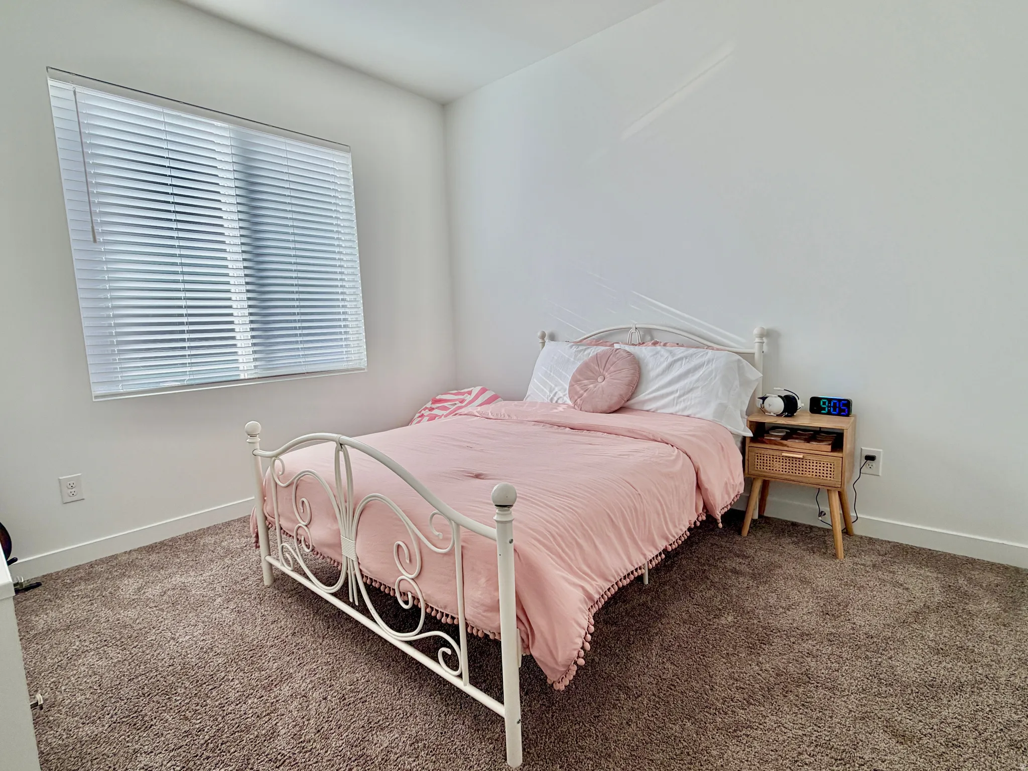 Bedroom featuring baseboards and carpet flooring