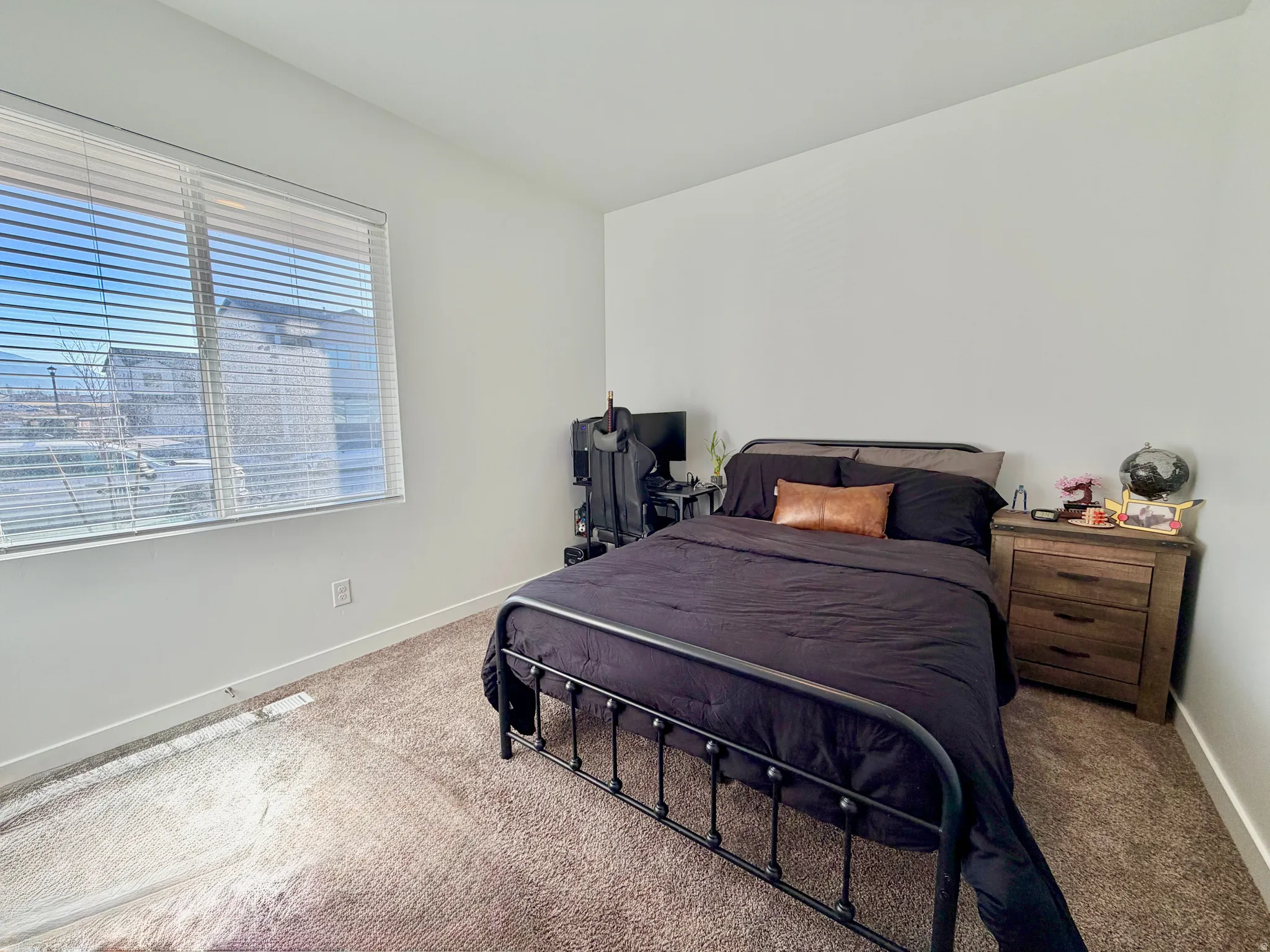Bedroom featuring baseboards and carpet flooring