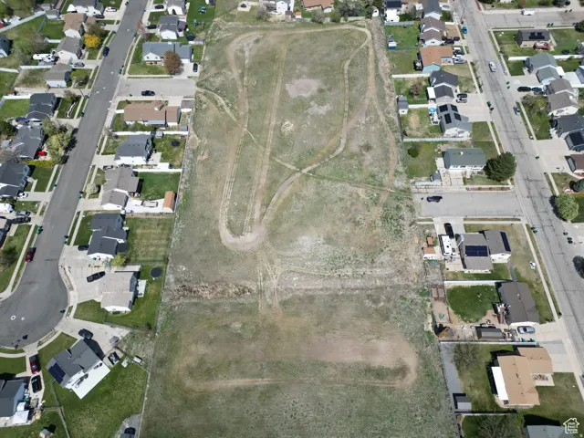 Aerial view of property's location featuring nearby suburban area