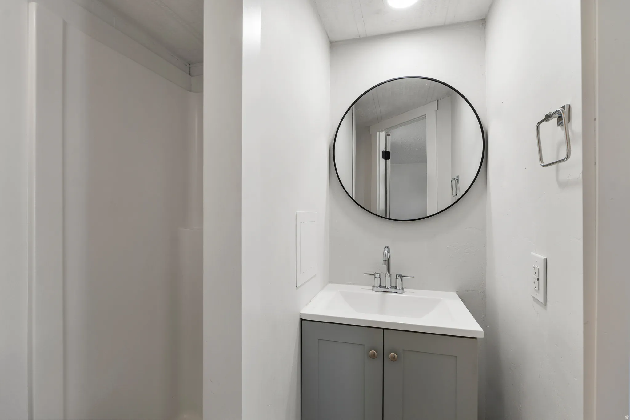 Full bathroom with vanity and a shower