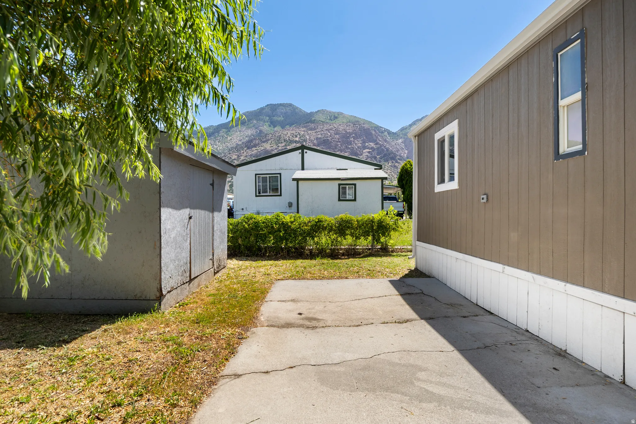 View of side of home featuring a mountain view