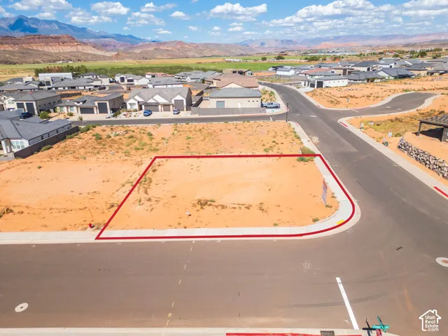 Corner lot with paved road access and curb