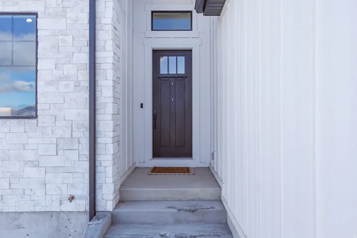 Property entrance with stone siding