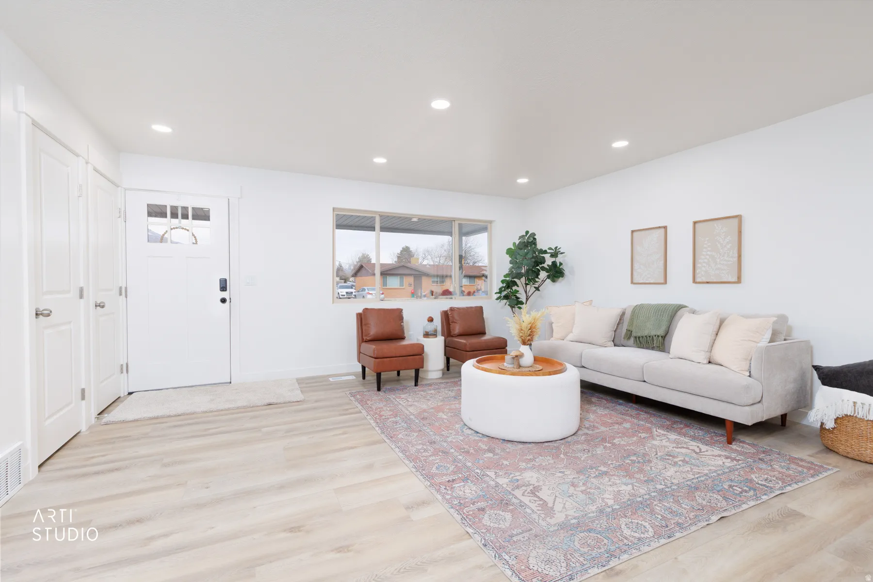 Living room featuring light wood-style floors and recessed lighting