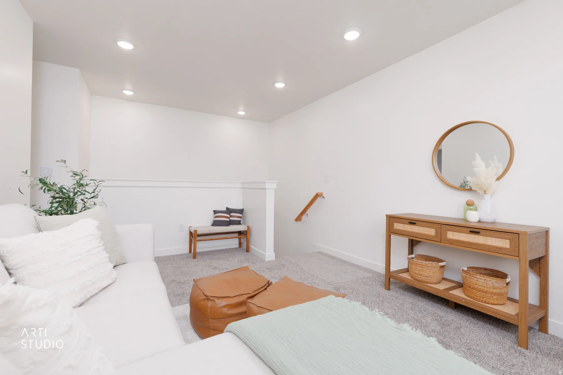 Living area featuring light colored carpet and recessed lighting