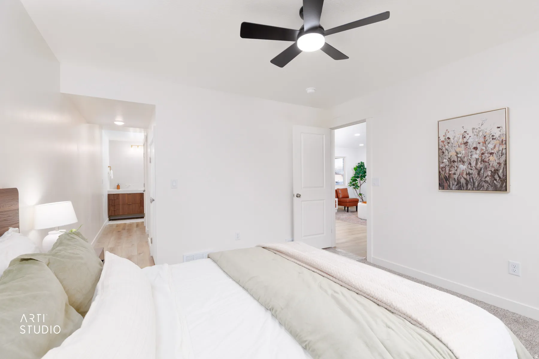 Bedroom with a ceiling fan and ensuite bathroom