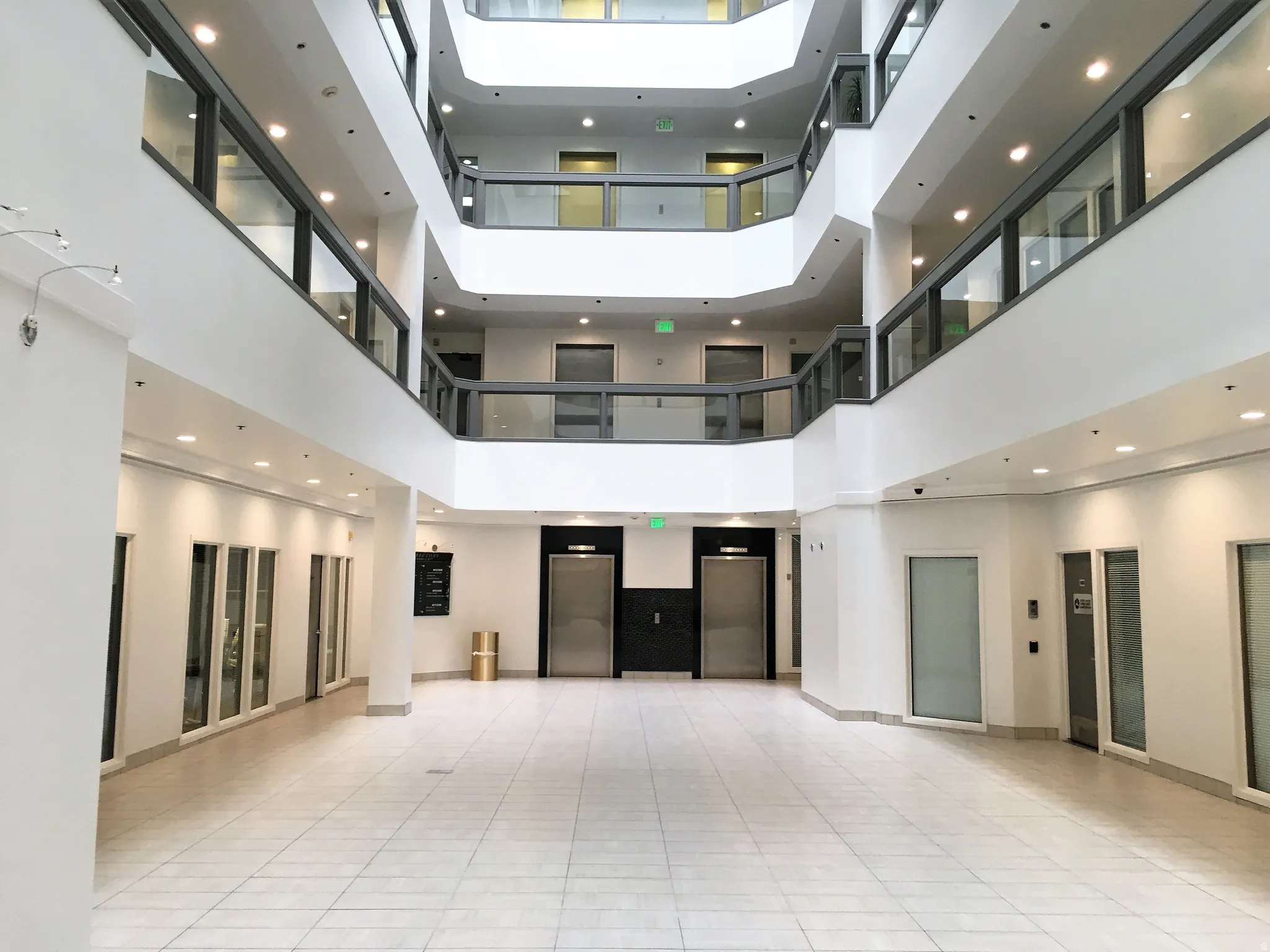 Common area with recessed lighting and a high ceiling
