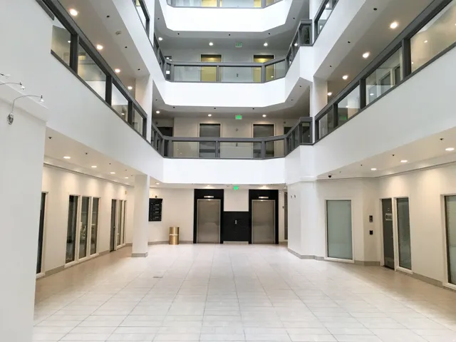 Common area with recessed lighting and a high ceiling