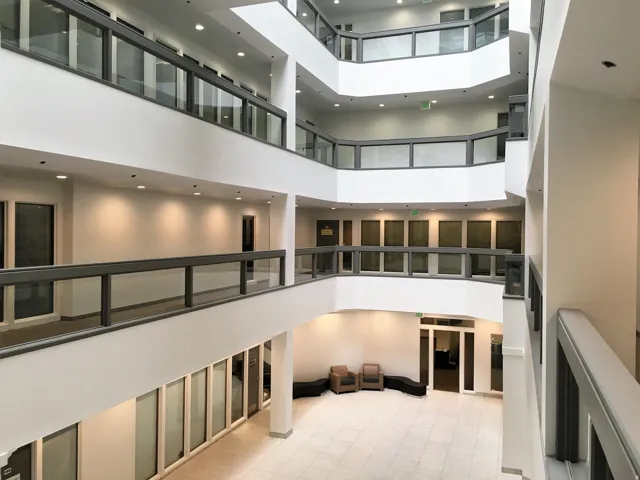 Common area with a towering ceiling and recessed lighting