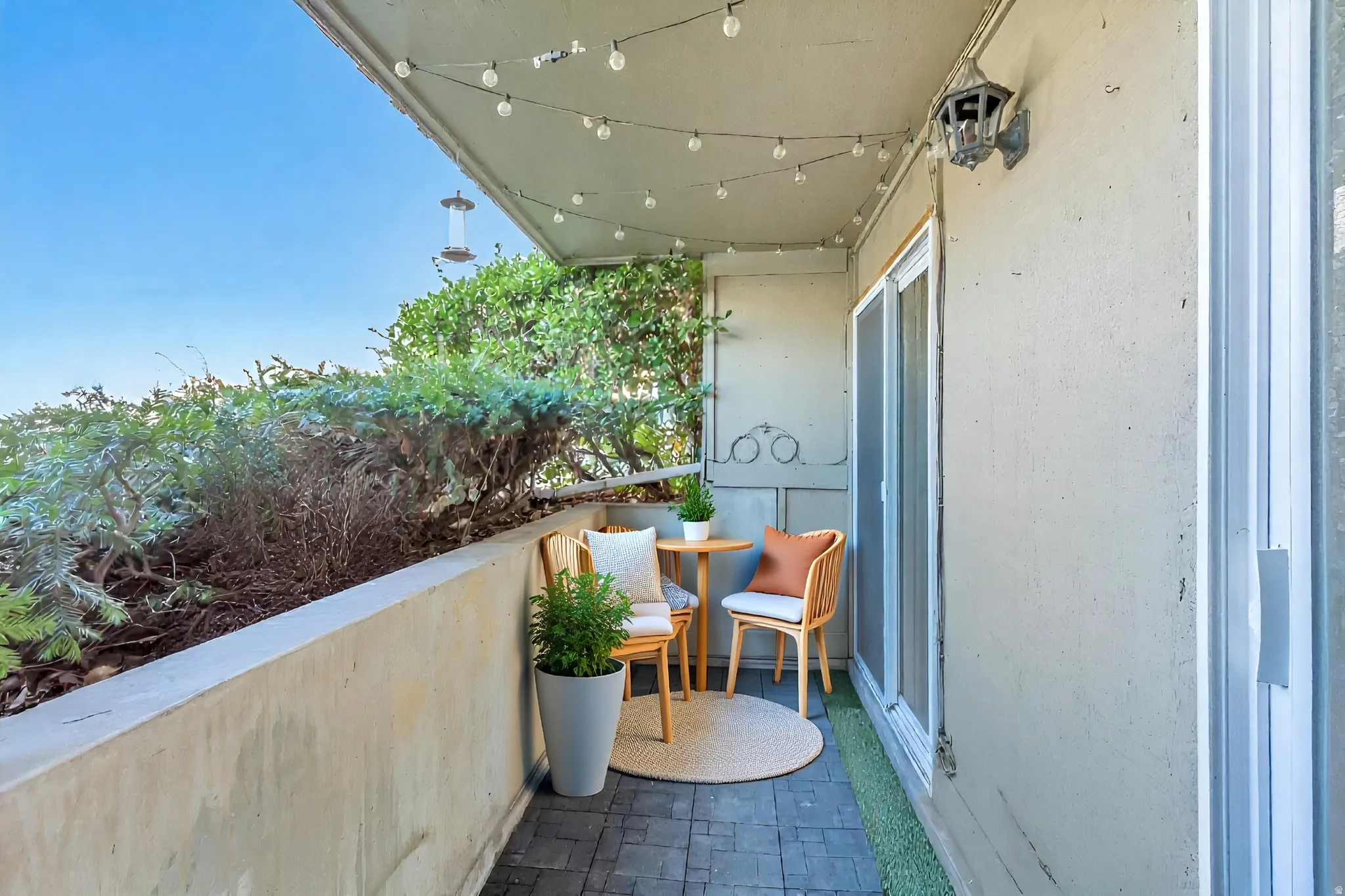 View of balcony. Virtually staged.