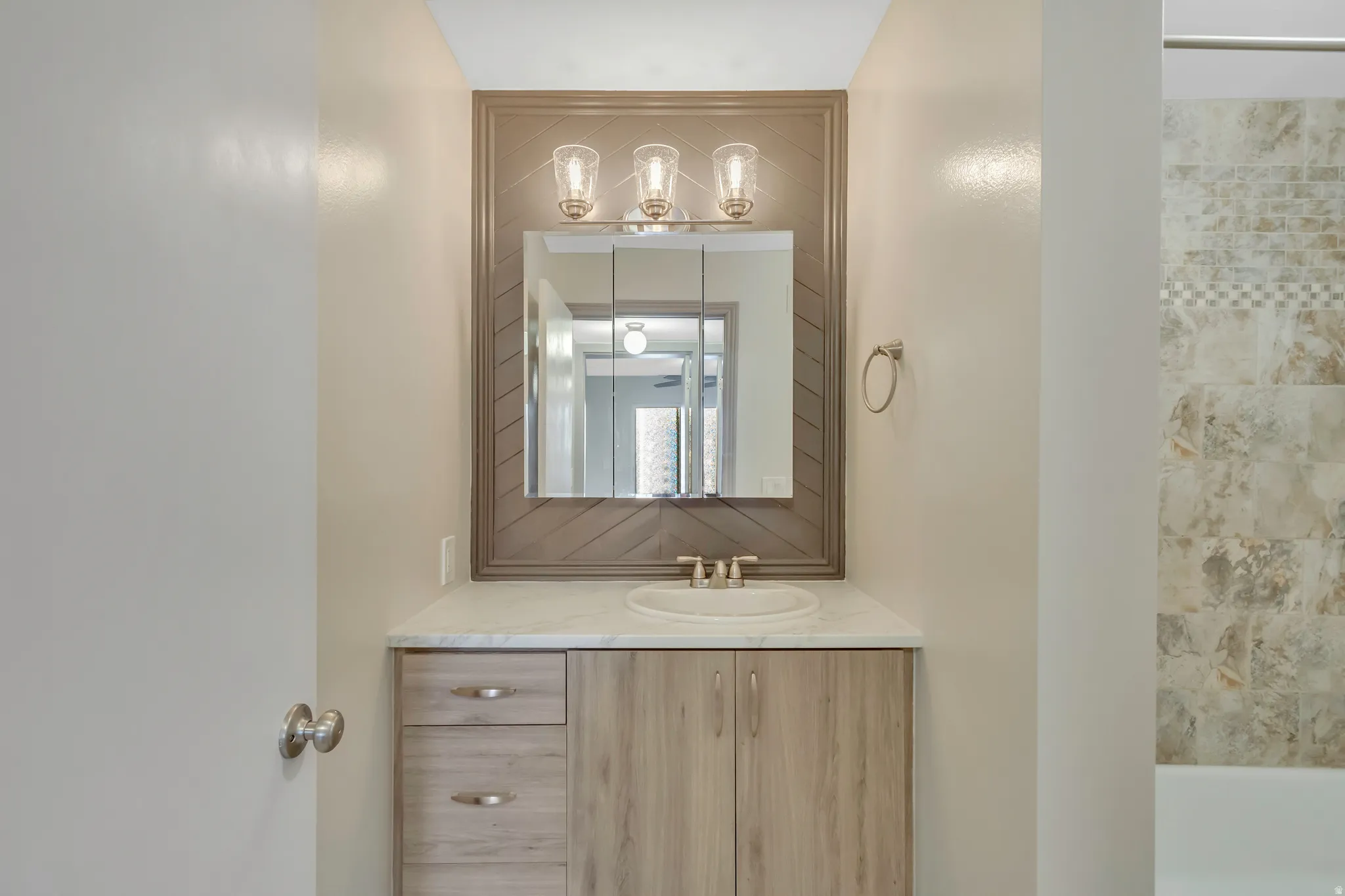 Bathroom featuring vanity and bathtub / shower combination