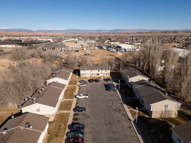 Aerial overview of property's location featuring a mountainous background