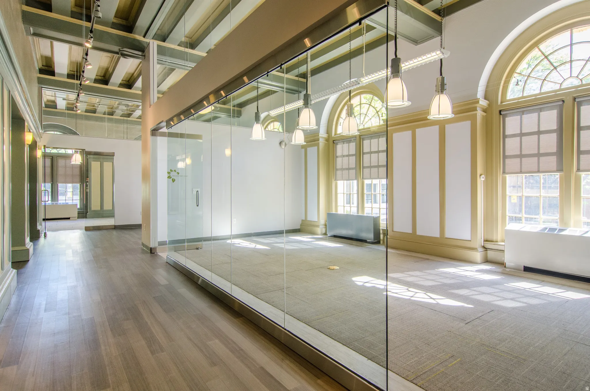 Interior space with a high ceiling and radiator