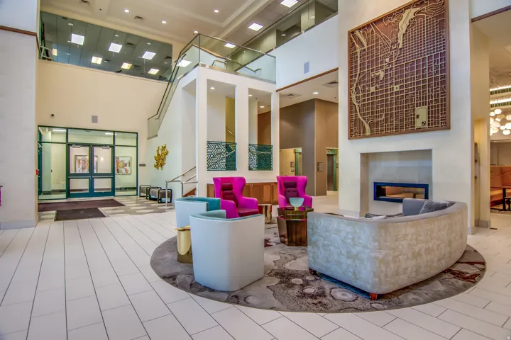 Community lobby with a high ceiling and recessed lighting