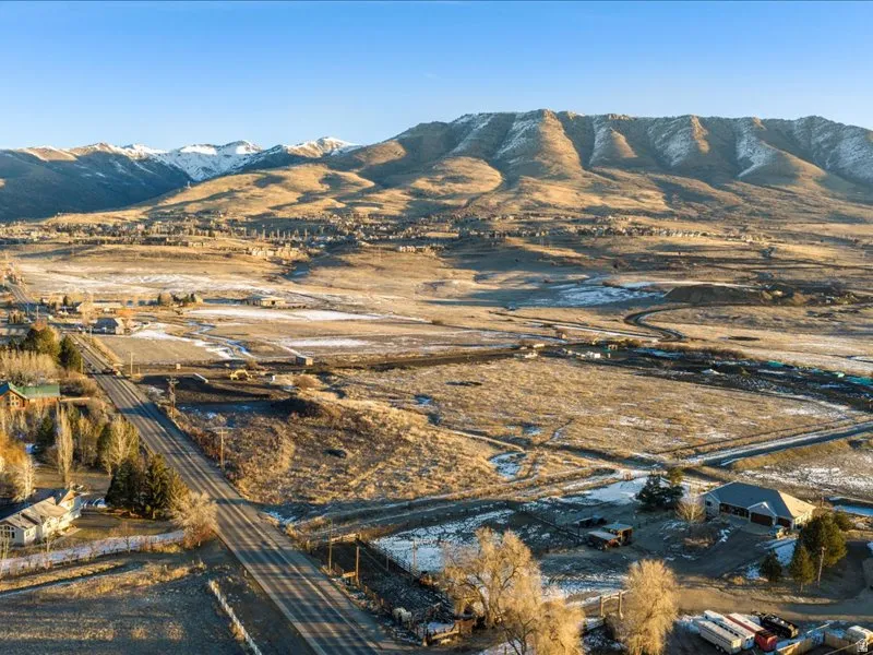 View of mountain backdrop featuring rural landscape