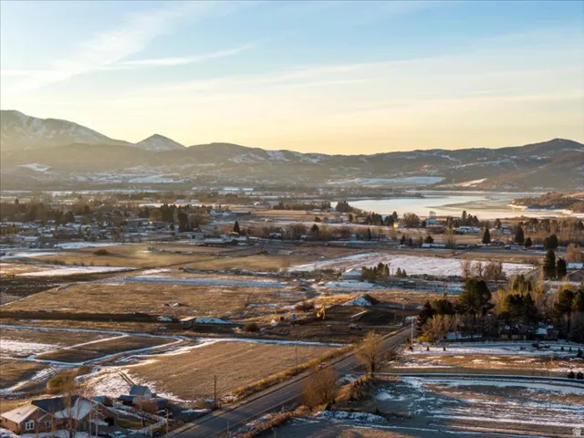 View of mountain backdrop featuring a large body of water