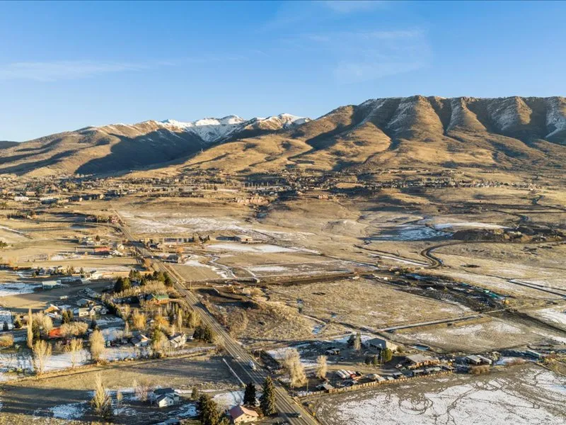 View of mountain backdrop featuring rural landscape