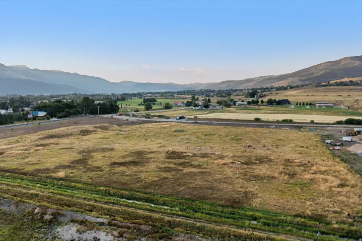 Expansive agricultural land with cleared acreage and established green pastures