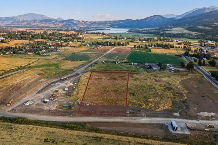 Expansive vacant land parcel with cleared development potential, positioned along established roadway infrastructure