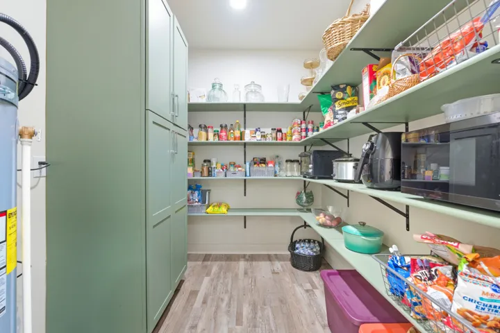 Pantry featuring water heater