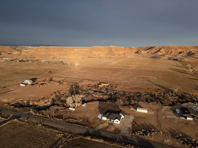 View of rural area with a desert landscape and a mountainous background