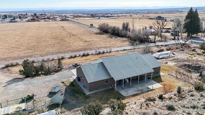 Aerial view of sparsely populated area with a mountainous background