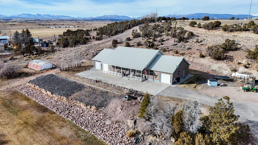 Aerial view of sparsely populated area featuring mountains and a desert landscape