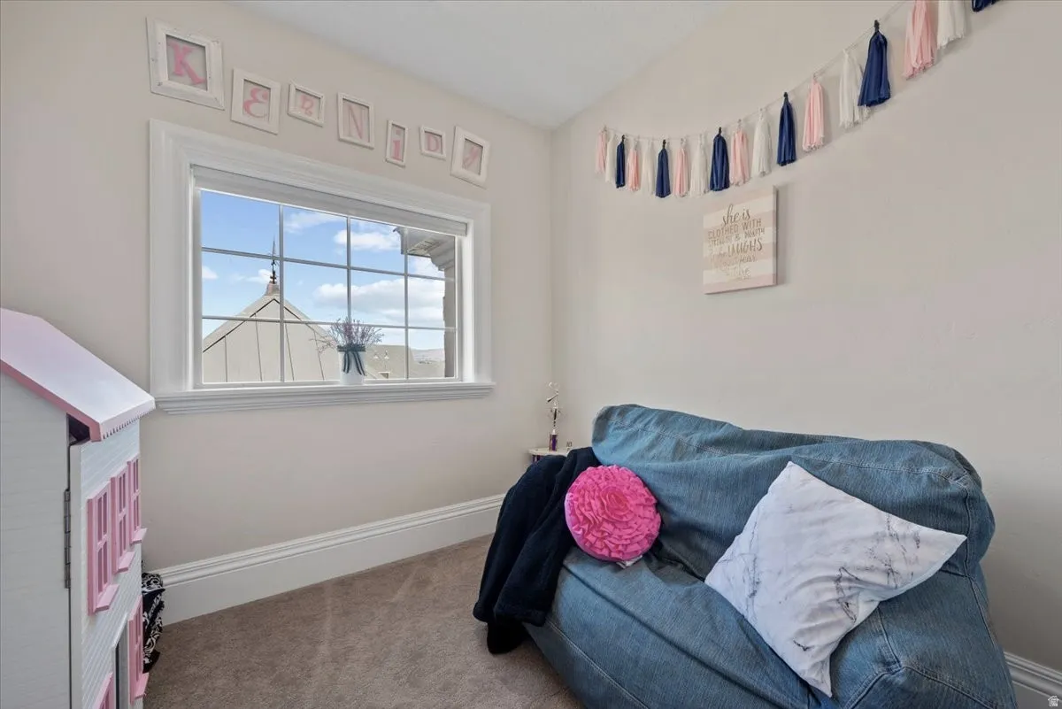 Hidden lounge behind swiveling bedroom bookshelf