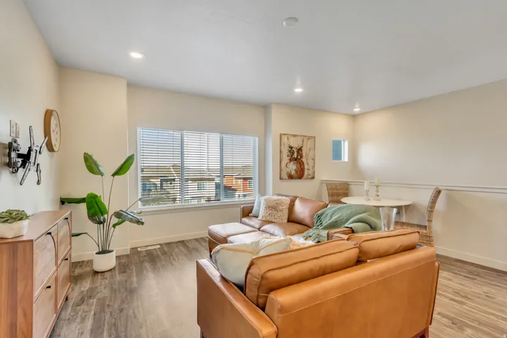 Living area featuring light wood-type flooring and recessed lighting