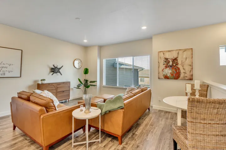 Living area featuring light wood-type flooring and recessed lighting