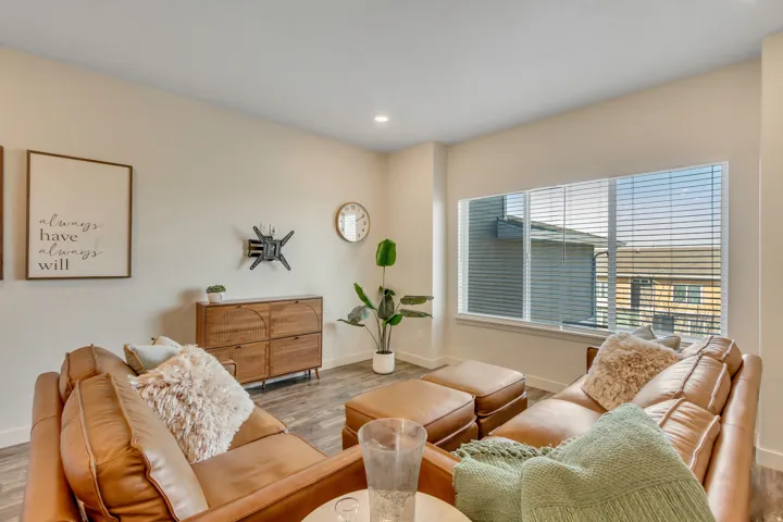 Living area featuring wood finished floors and recessed lighting
