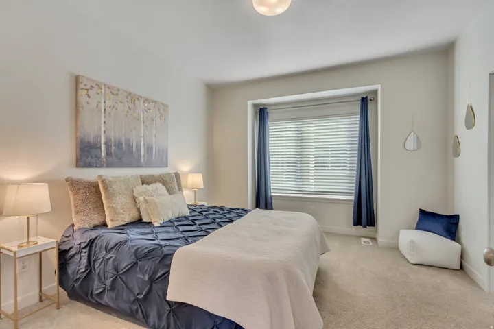 Bedroom with carpet floors and baseboards