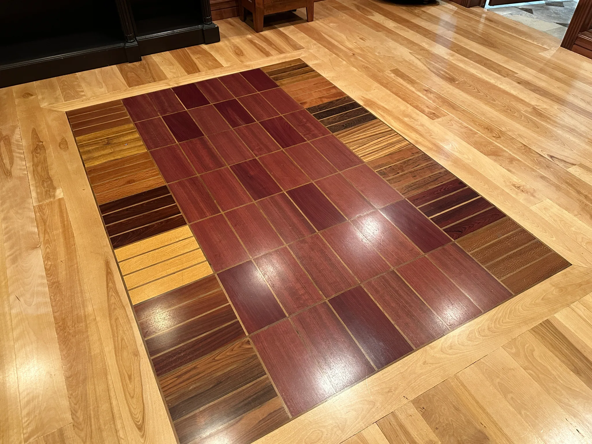 Detailed view of parquet flooring and inlaid floor details