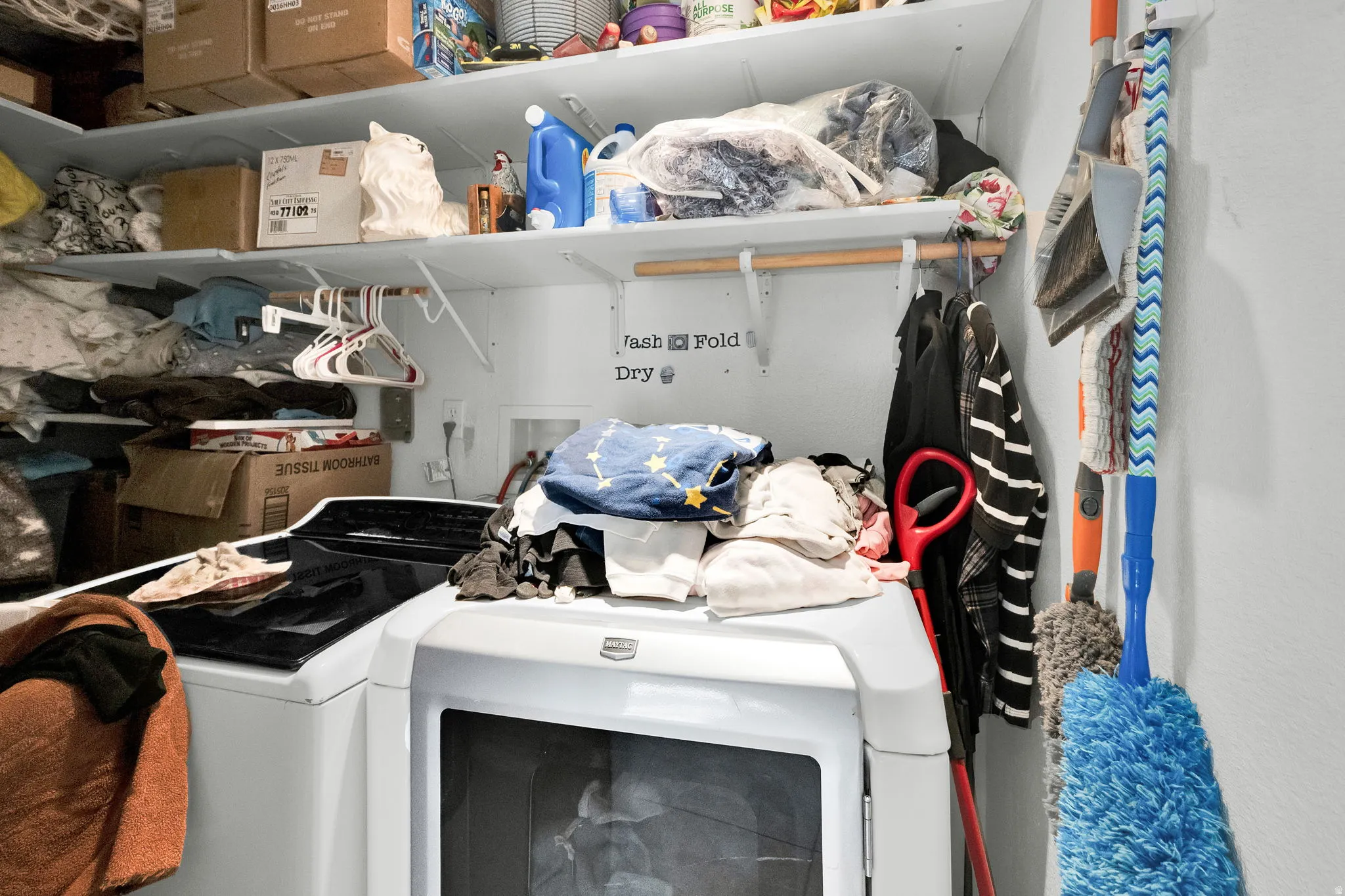 Washroom featuring washer and clothes dryer