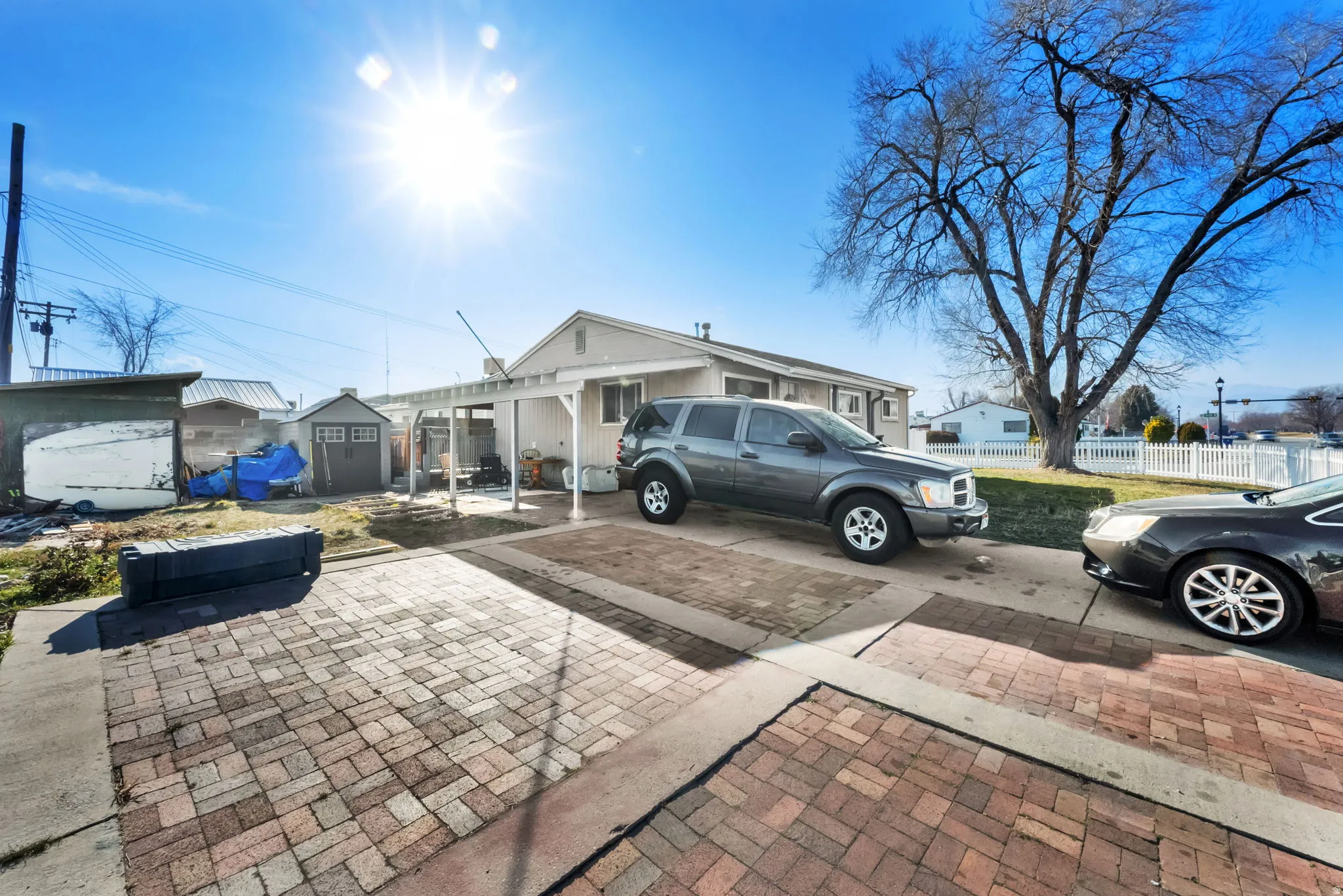 View of front of home with a shed