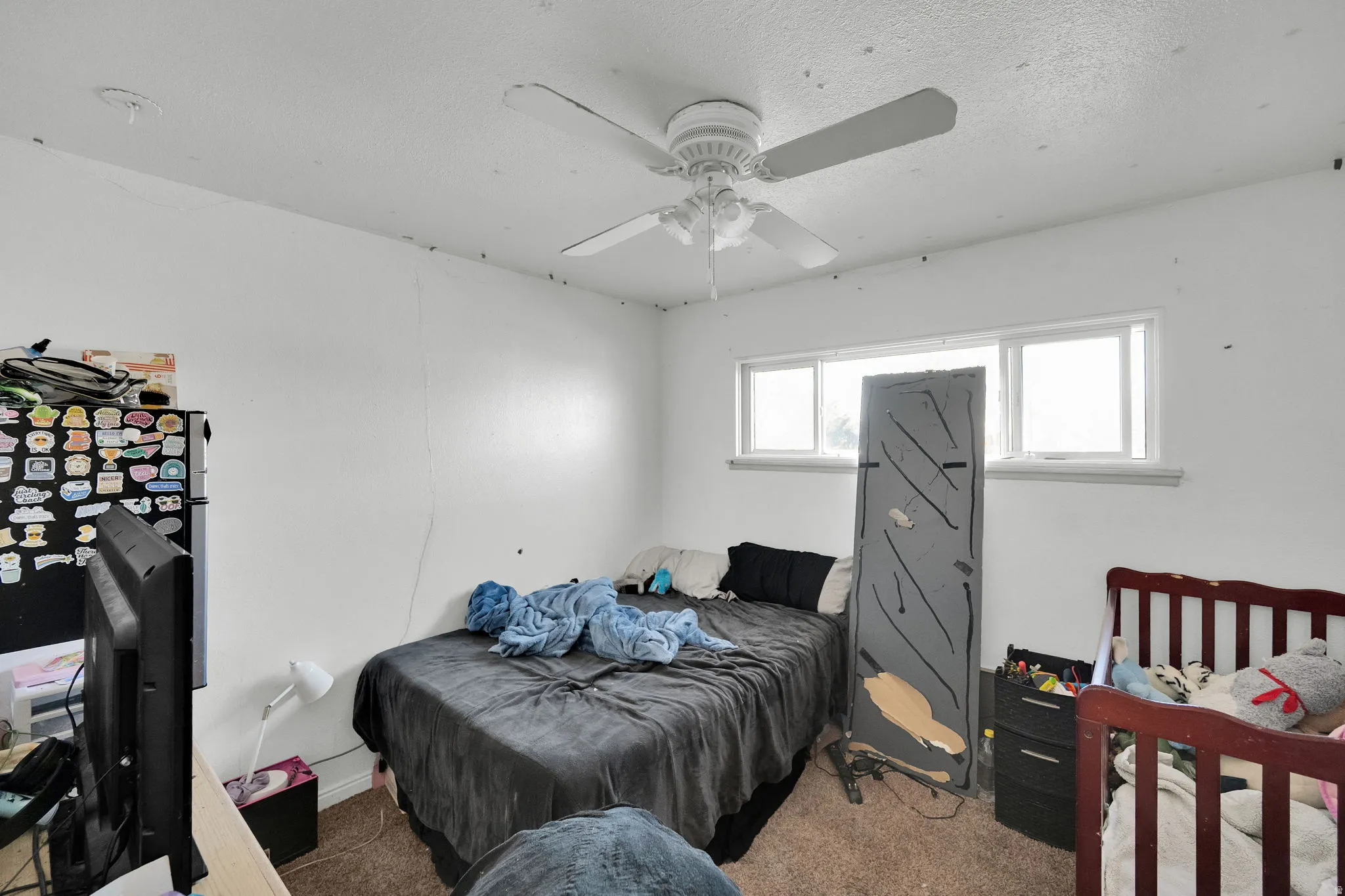 Bedroom featuring carpet and a ceiling fan