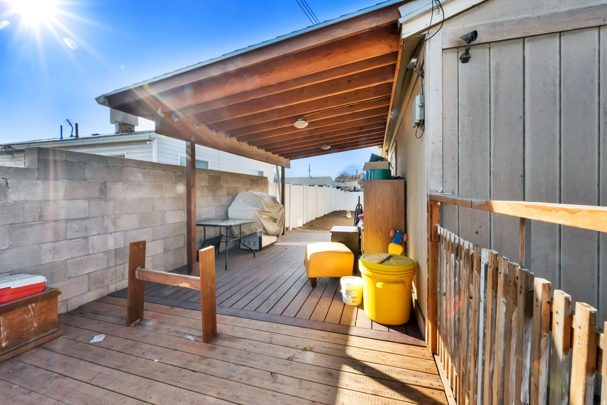 Wooden terrace featuring outdoor dining area