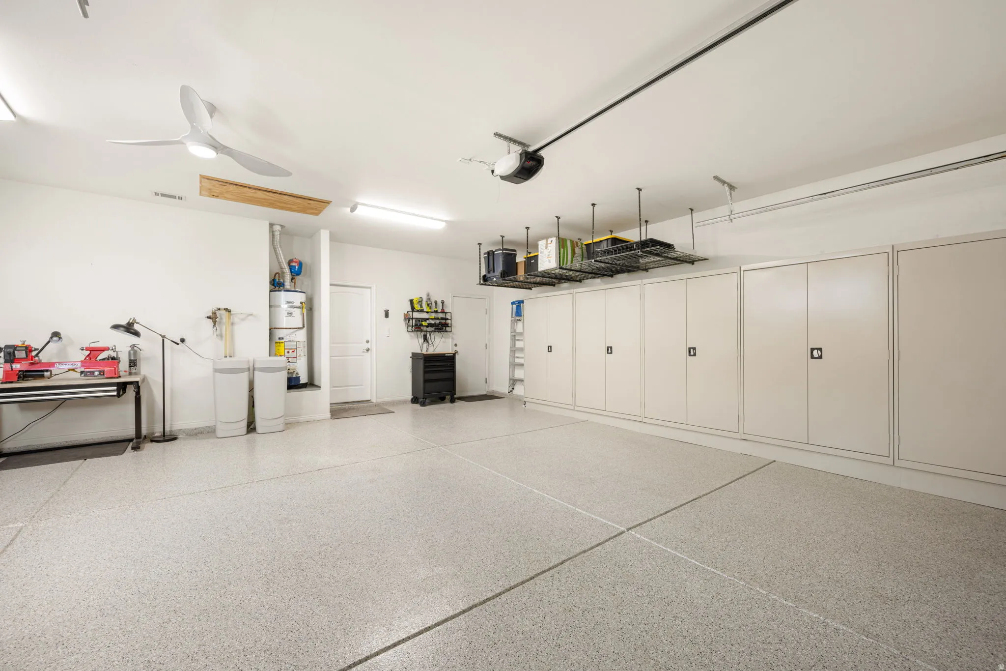 Garage with built in custom cabinets for storage