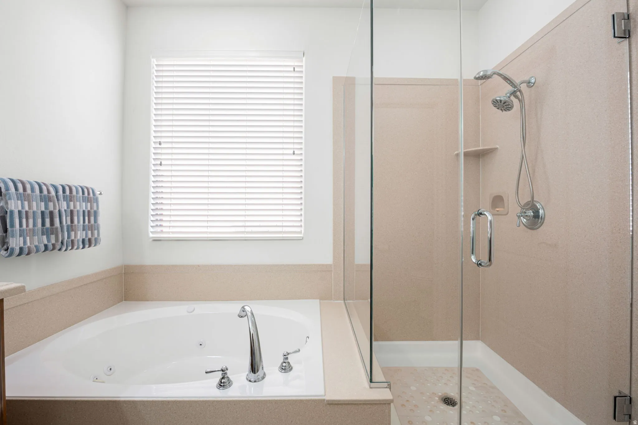 Primary bathroom with jetted tub and walk in shower