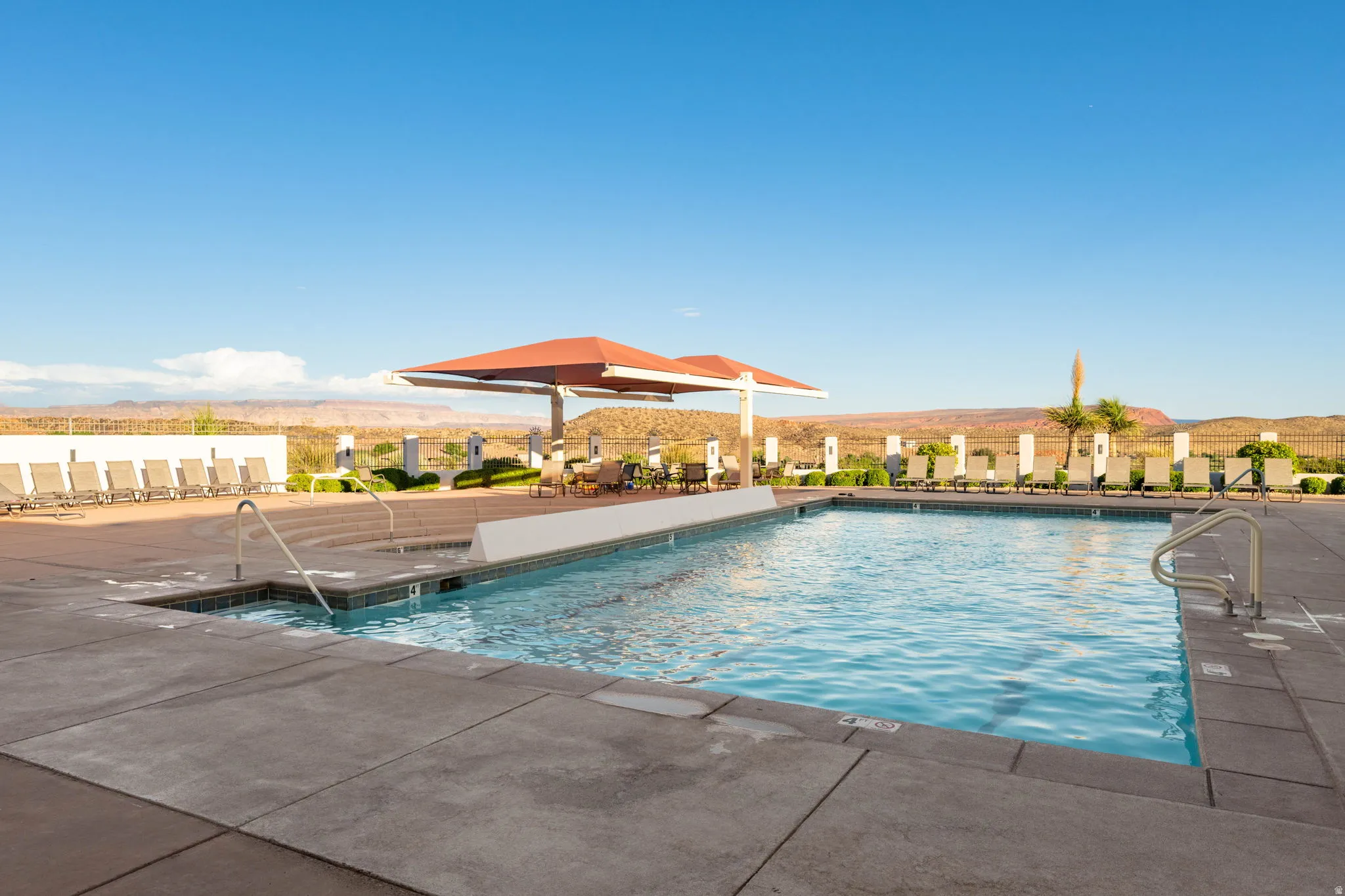Community pool with a mountain view and a patio