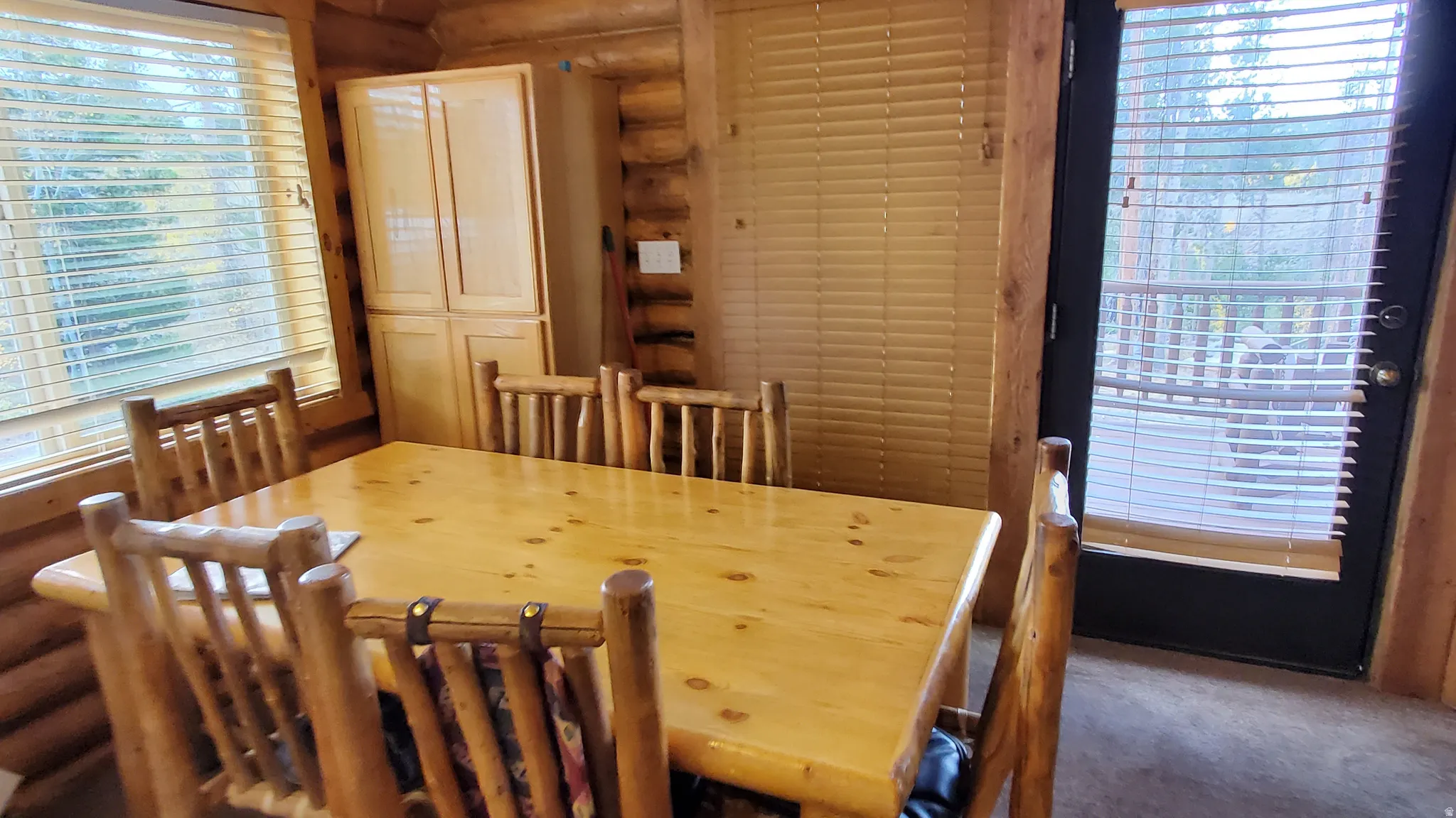 Dining area featuring rustic walls
