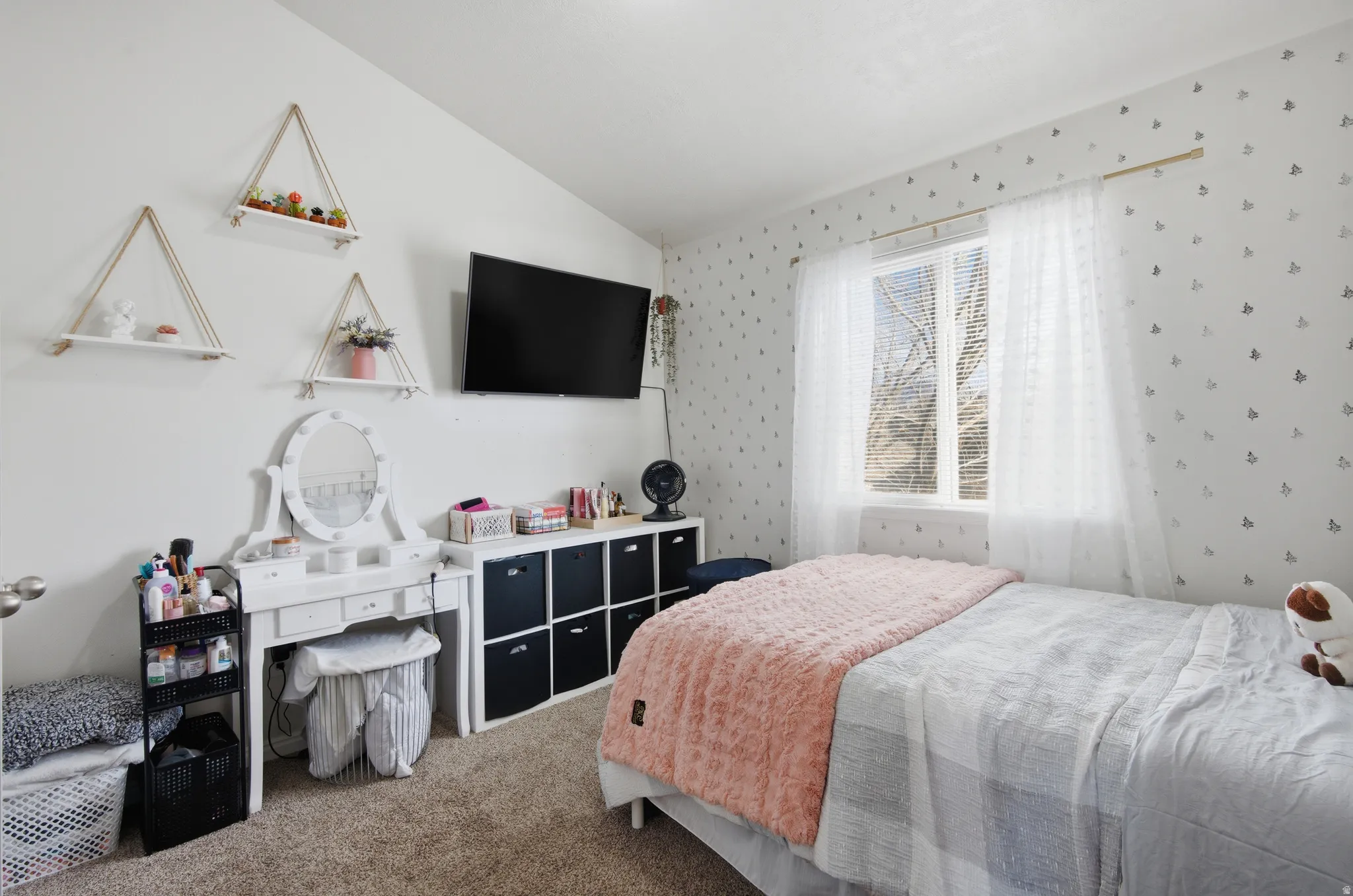 Carpeted bedroom with vaulted ceiling