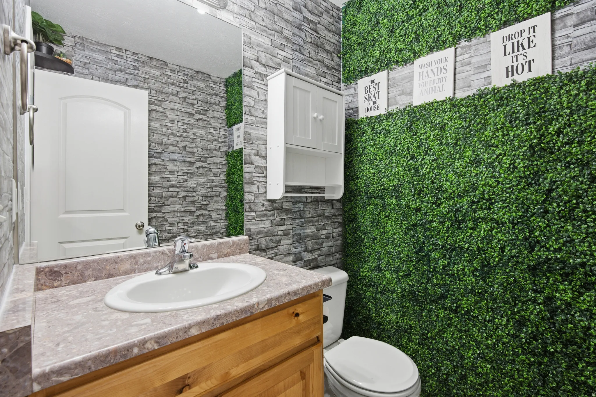 Bathroom with toilet and vanity
