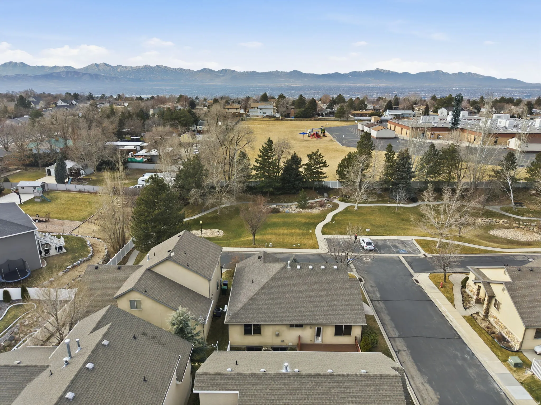 View of property location with a mountainous background and nearby suburban area