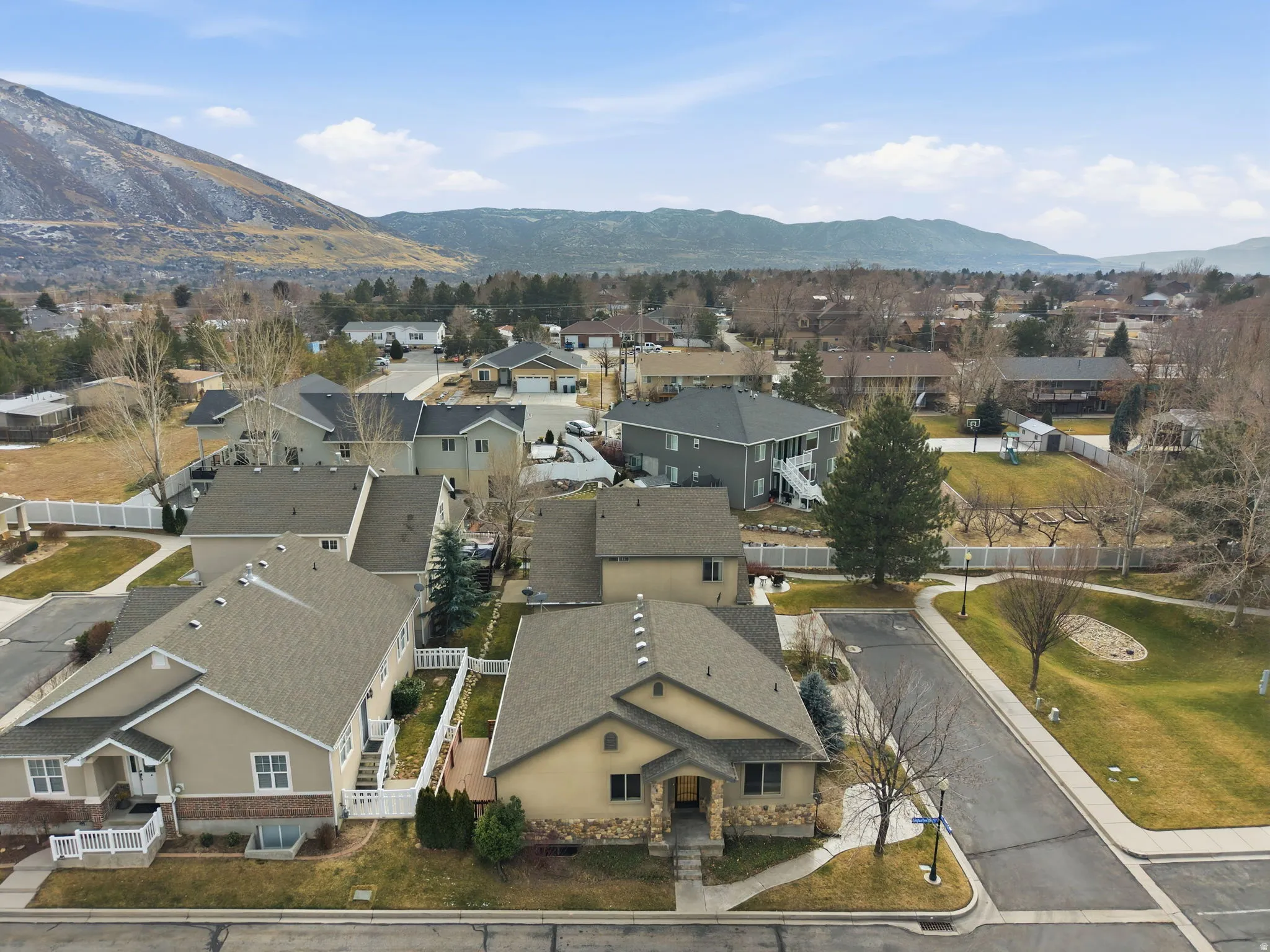 Aerial view of residential area with a mountainous background