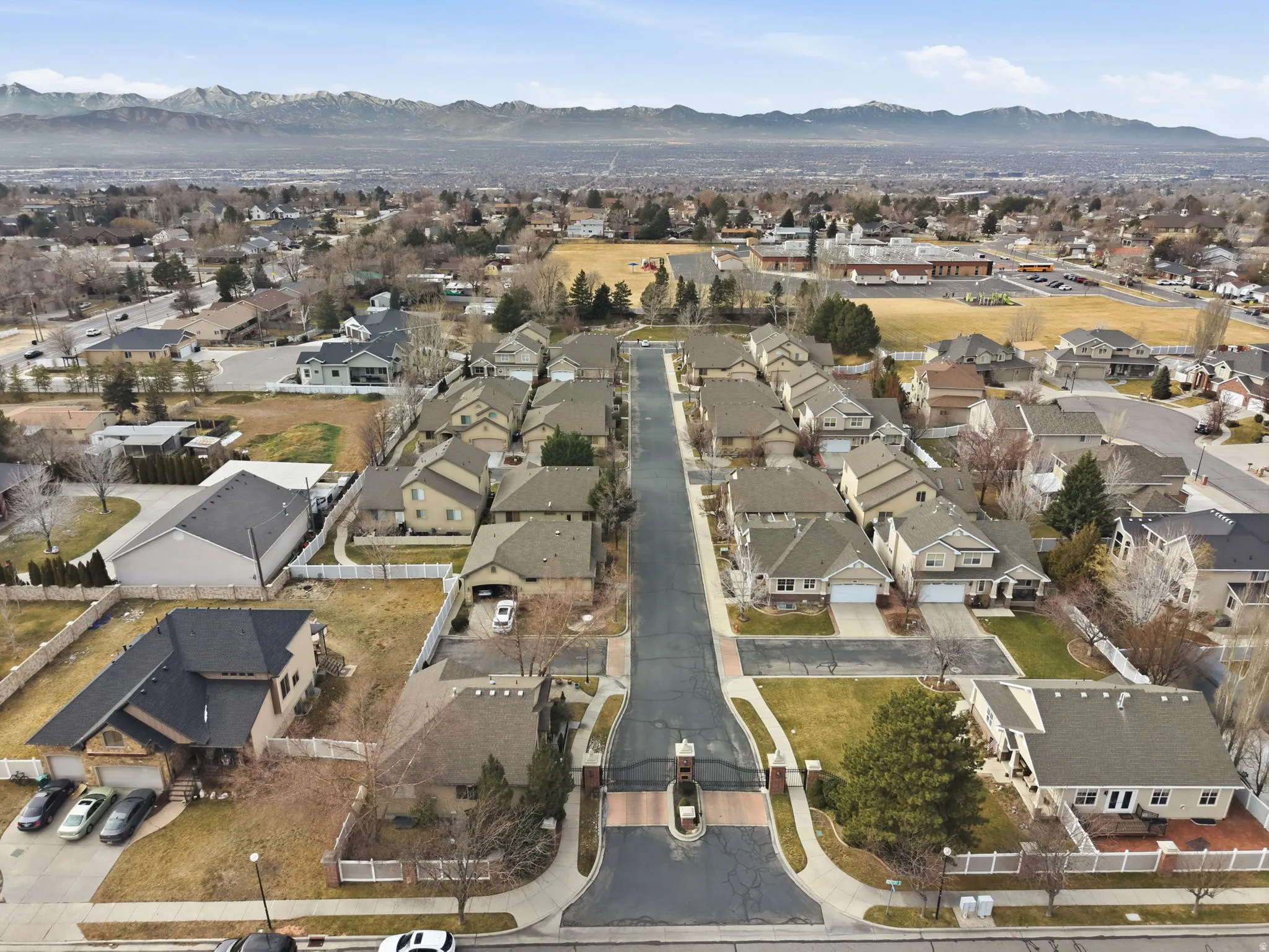 Aerial overview of property's location featuring mountains and nearby suburban area