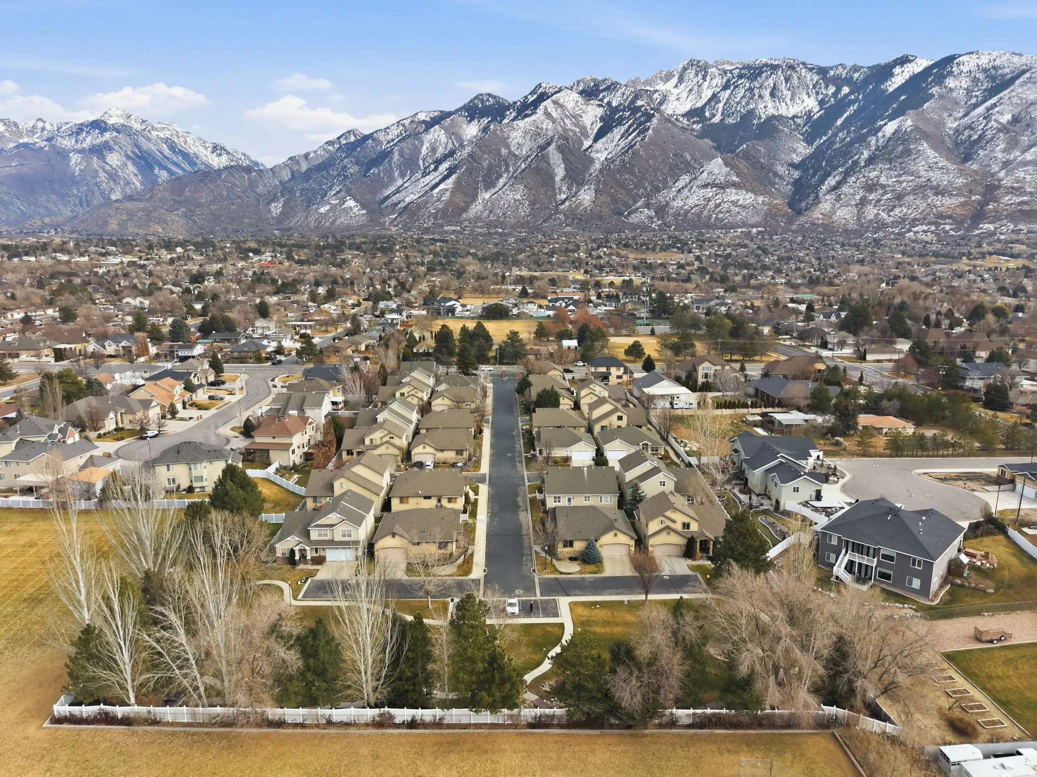 Aerial view of residential area featuring a mountain backdrop